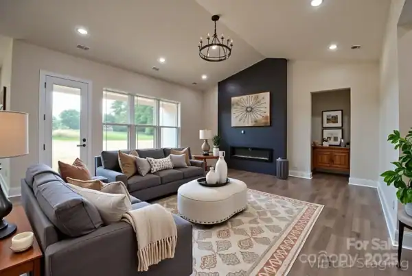 Modern living room interior with black accent wall and contemporary fireplace, featuring ample natural light.