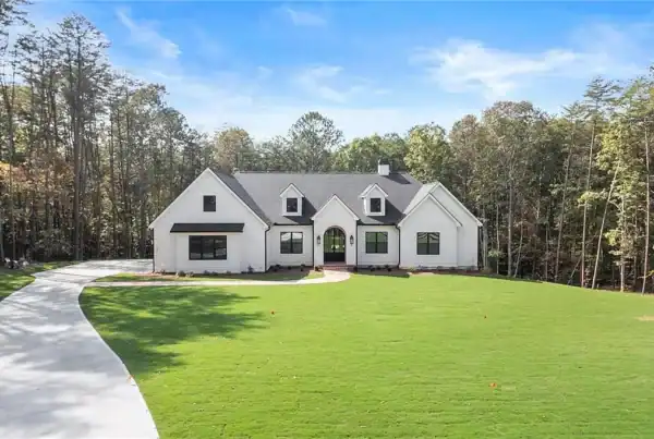 Elegant new custom home by Bertamini Development featuring modern design and lush landscaping.